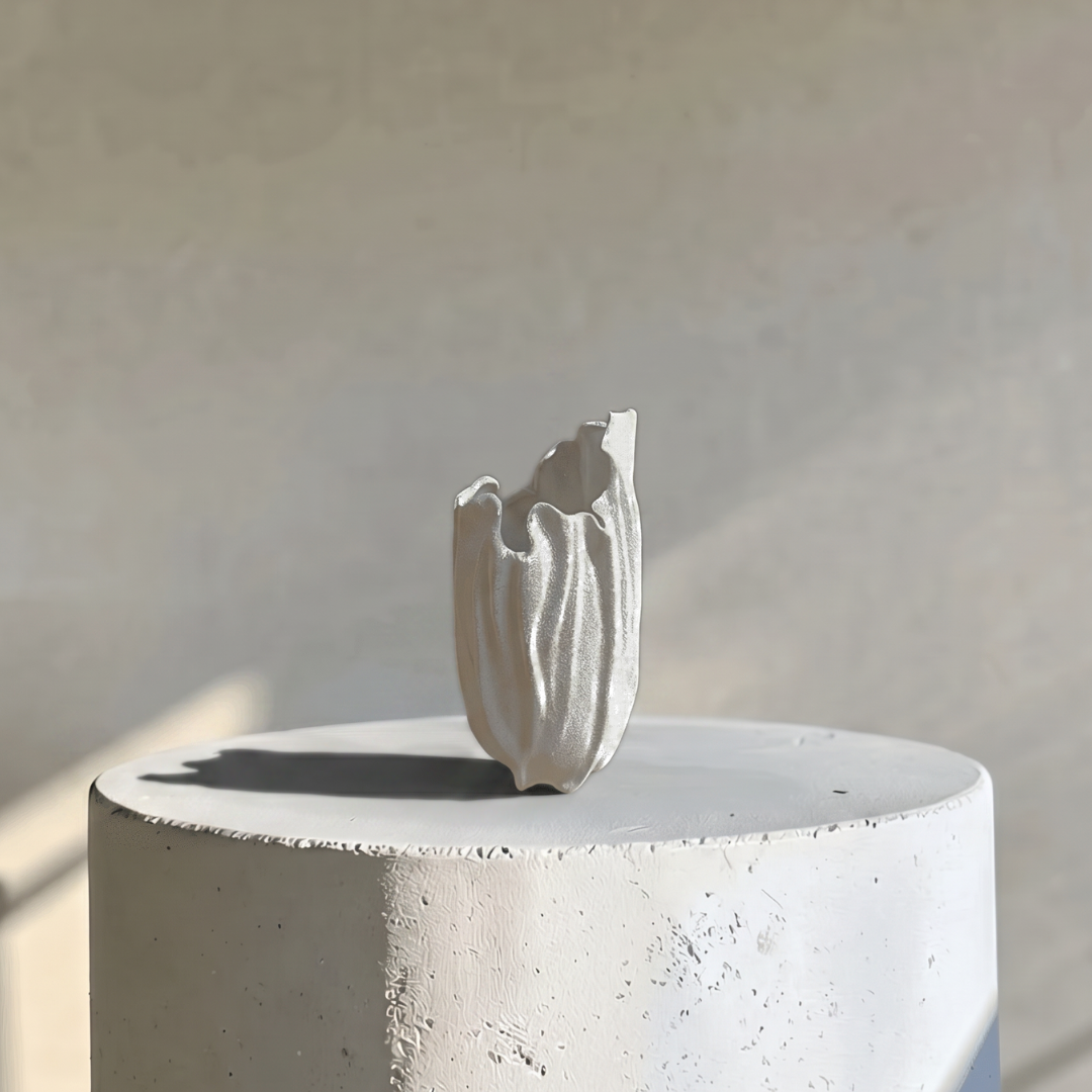 Lunaria Ivory Ceramic Sculptural Vase, 4.9"L x 4.5"W x 8.7"H.